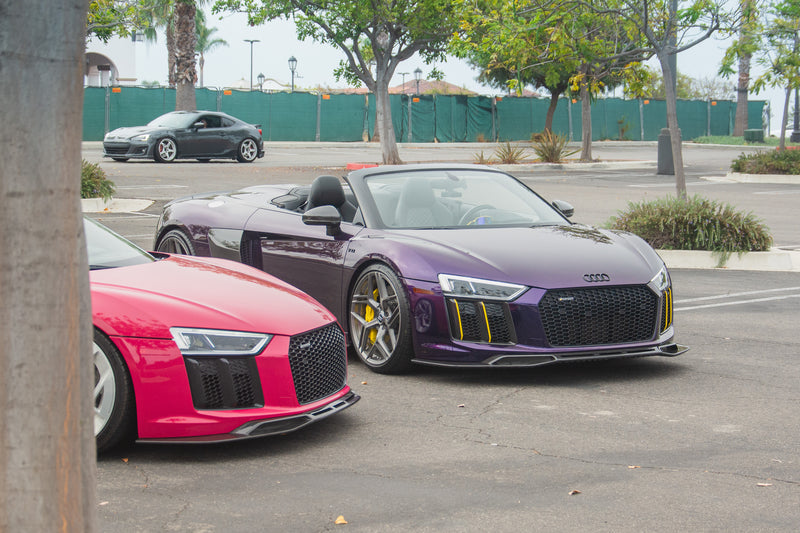 Avalanche Design dry carbon front lip splitters on Audi R8 Type 4S Spyder and Coupe, with the Spyder facing forward and the Coupe’s front corner in the foreground
