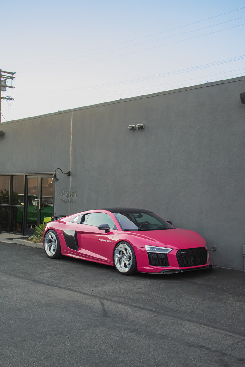 Avalanche Design Audi R8 Gen 2 front three quarter view with carbon fiber aero components, contrasting carbon details, lowered stance and signature pink exterior