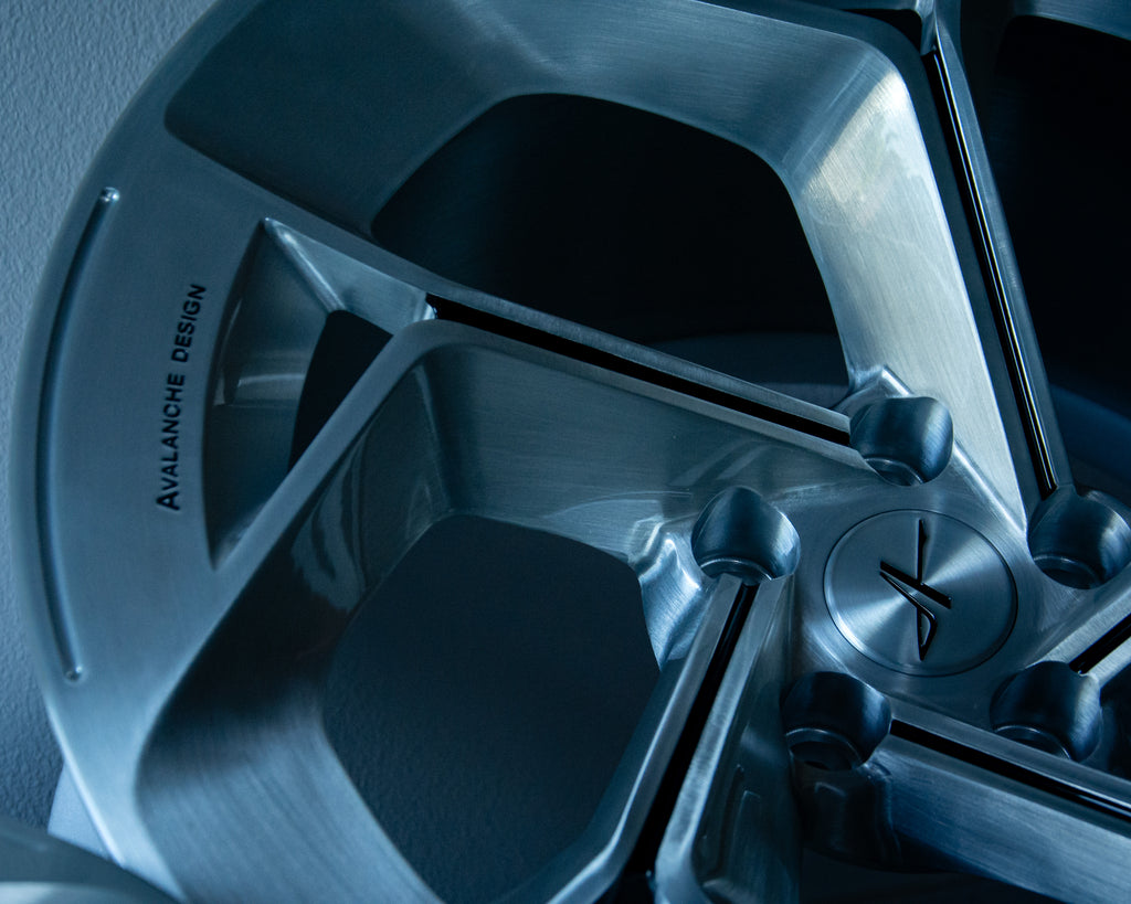 Close up of a bespoke custom forged wheel by Avalanche Design, featuring deep concave spoke geometry, precision machined detailing, custom offset, and vehicle specific fitment for performance and exotic cars.